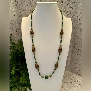 Green bead necklace with glass swirl beads